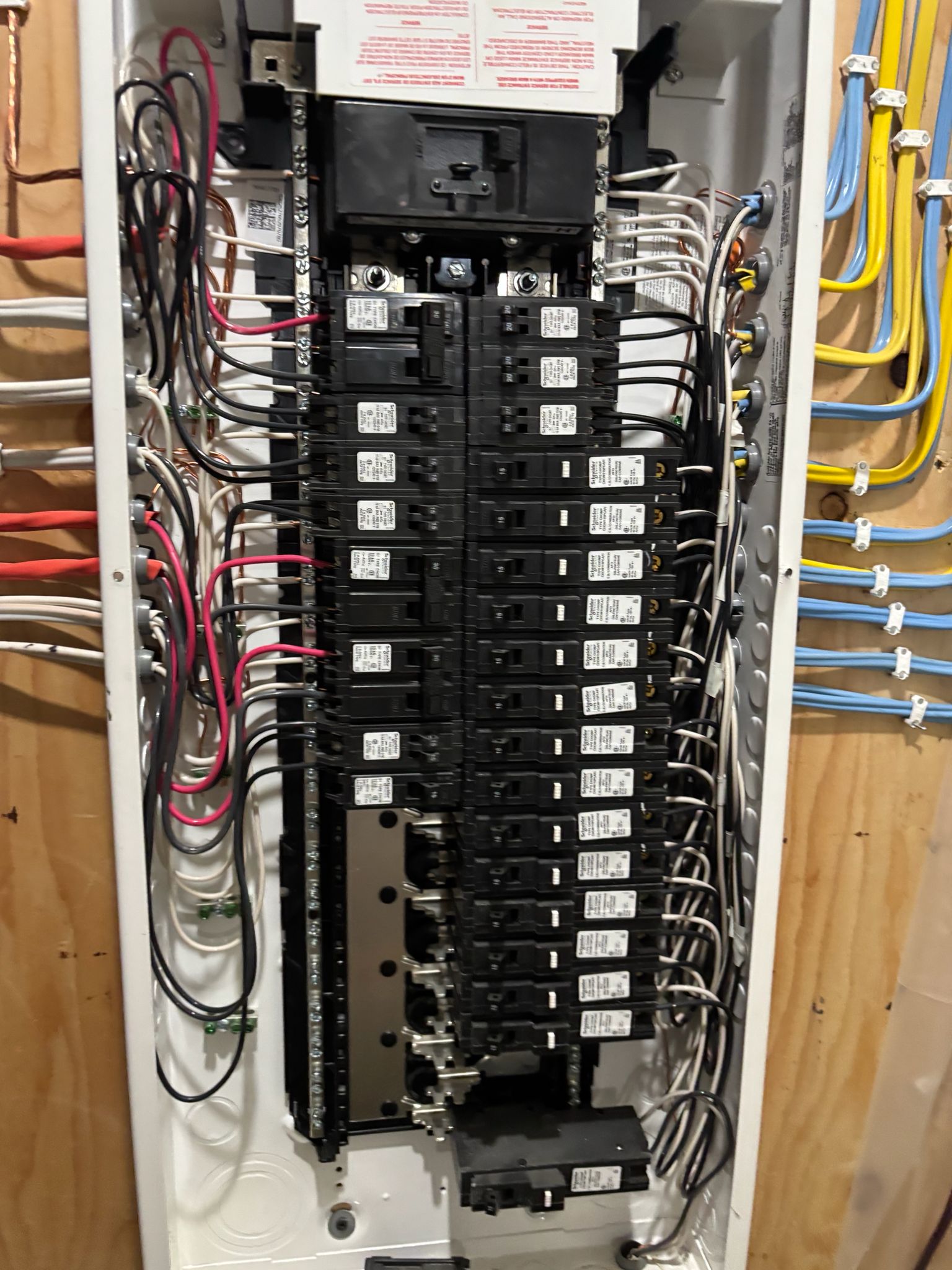 Residential electrical panel showing circuit breakers and wiring